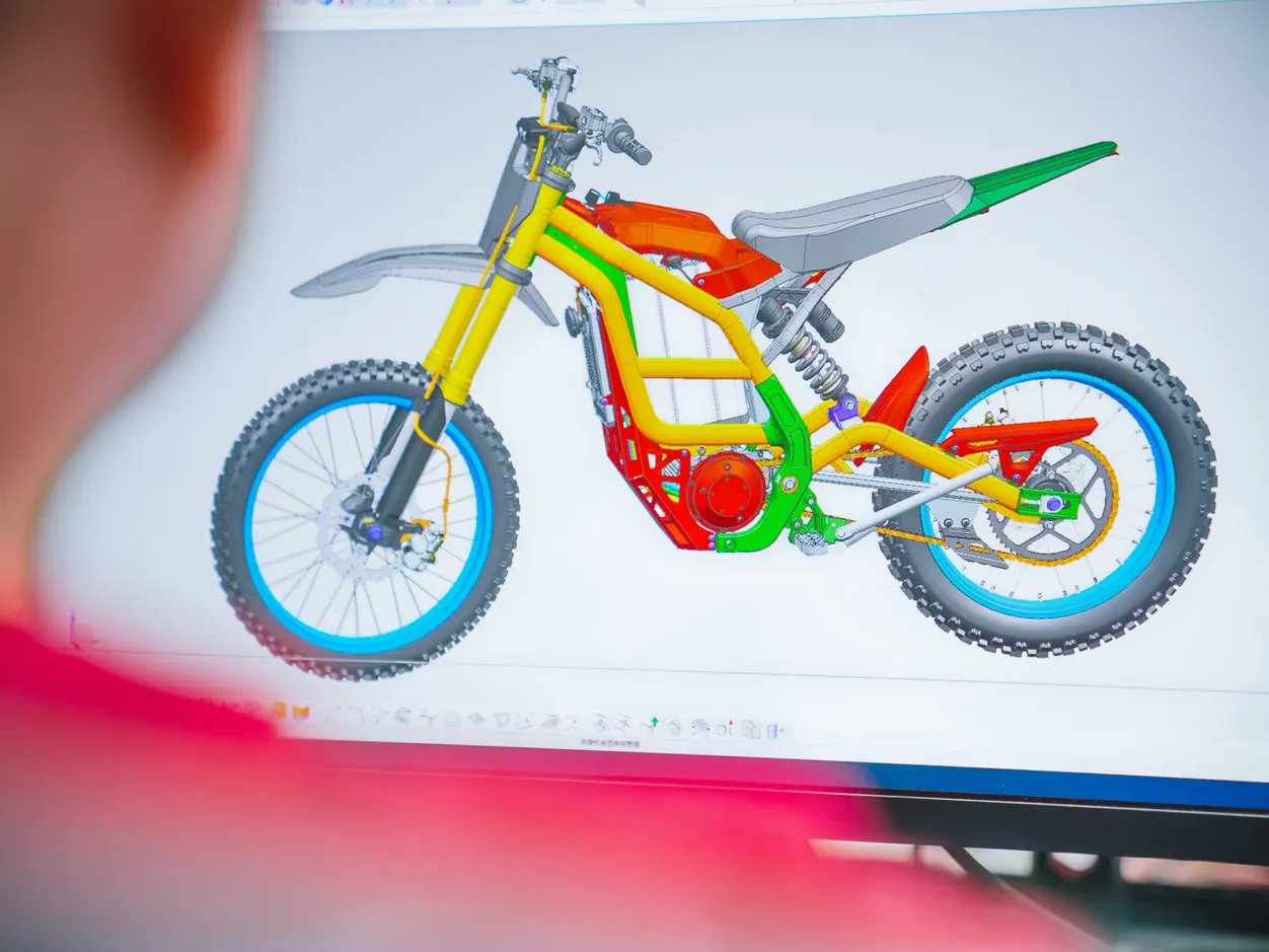 ARKAMOTO product development team reviewing a motorcycle concept